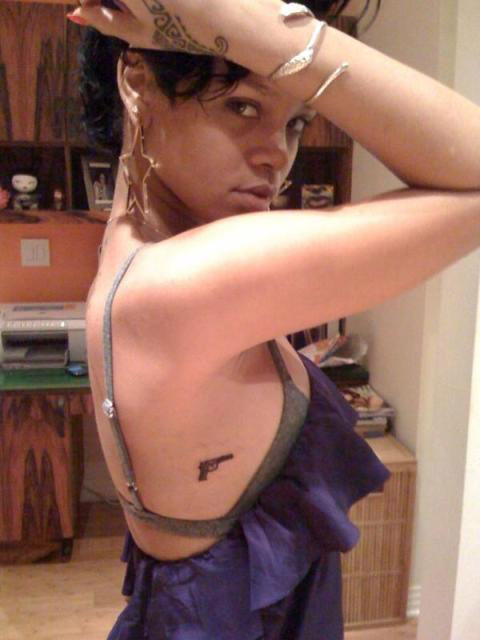  Rihanna getting a gun tattoo. Nothing.