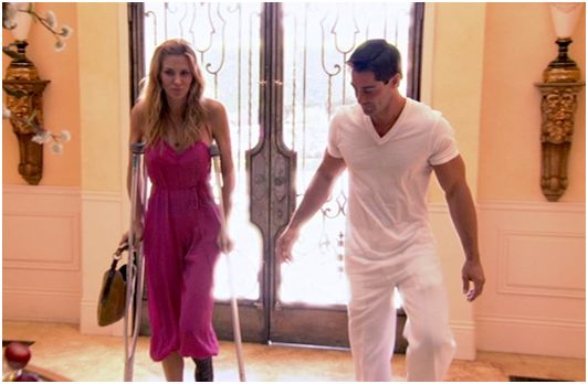 rhobh-brandi-hot-pink-camelteo-onsie-with-crutches